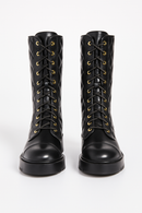 Bottes Matelassées Chanel Noires – Élégance Rebelle et Couture Parisienne